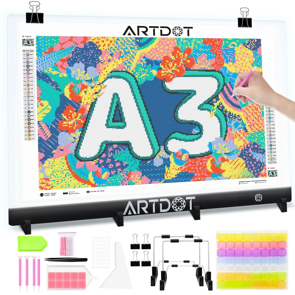 A3 light pad on a stand lighting a colourful diamond painting canvas, with pens, wax, tweezers, trays and small storage boxes laid out below it