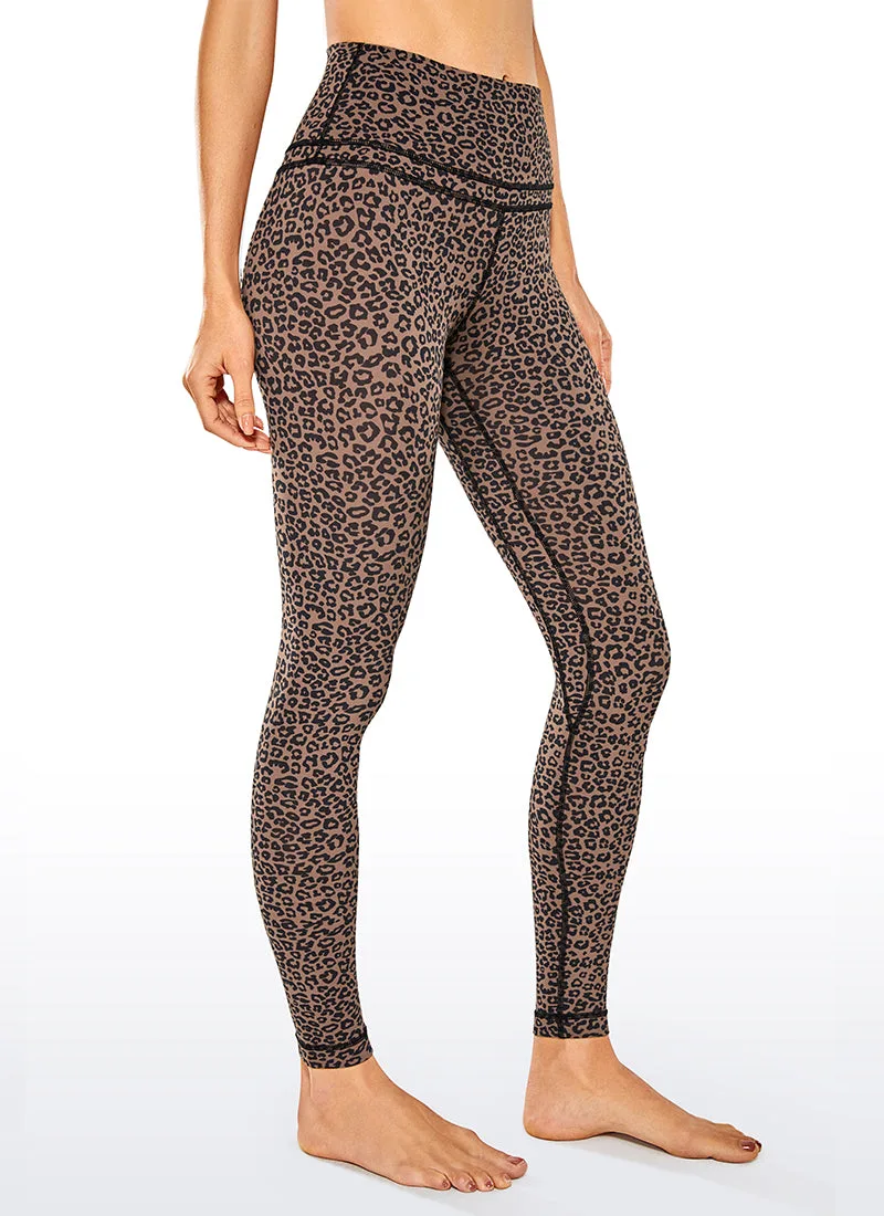 Leopard print legging shown from a three quarter angle with the double seam visible across the waistband, worn barefoot