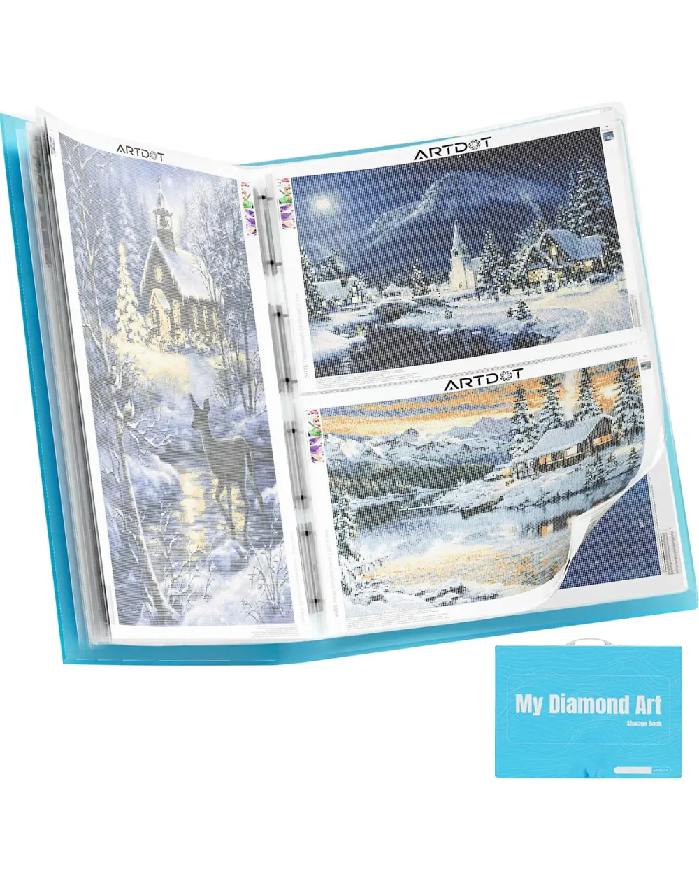 Ring binder folder open to clear sleeves holding part finished winter scene canvases, with a closed blue folder labelled My Diamond Art beside it