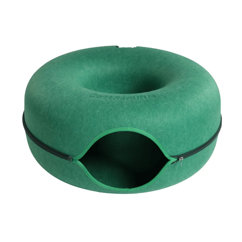 The donut shaped felt cat cave in deep green, with a contrasting dark zip running around the middle