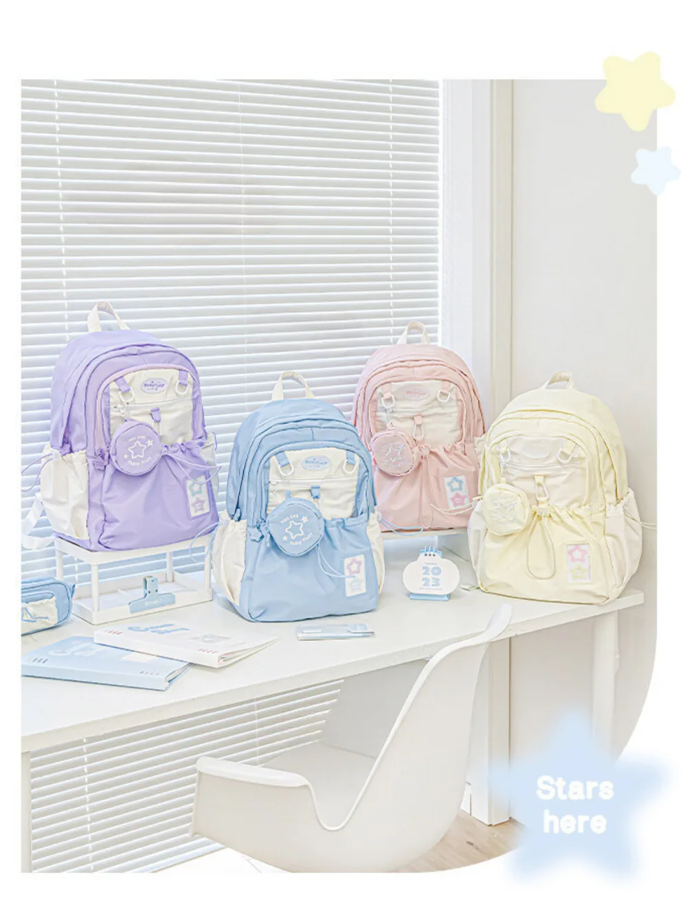 Best Journaling Supplies and Aesthetic Stationery: How to Build a Complete Kit in 2026 10 Four pastel backpacks in lilac, blue, pink and cream, each with a round zip pouch clipped to the front and a small star patch, arranged on a white desk by a window