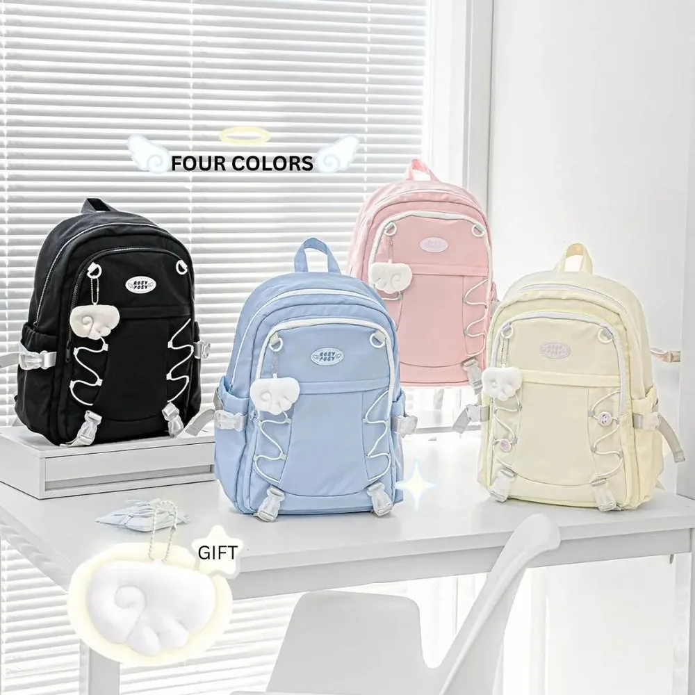 Best Journaling Supplies and Aesthetic Stationery: How to Build a Complete Kit in 2026 11 Four Wingwing backpacks in black, blue, pink and cream, each with a soft white angel wing charm clipped to the front, with a separate wing charm shown below