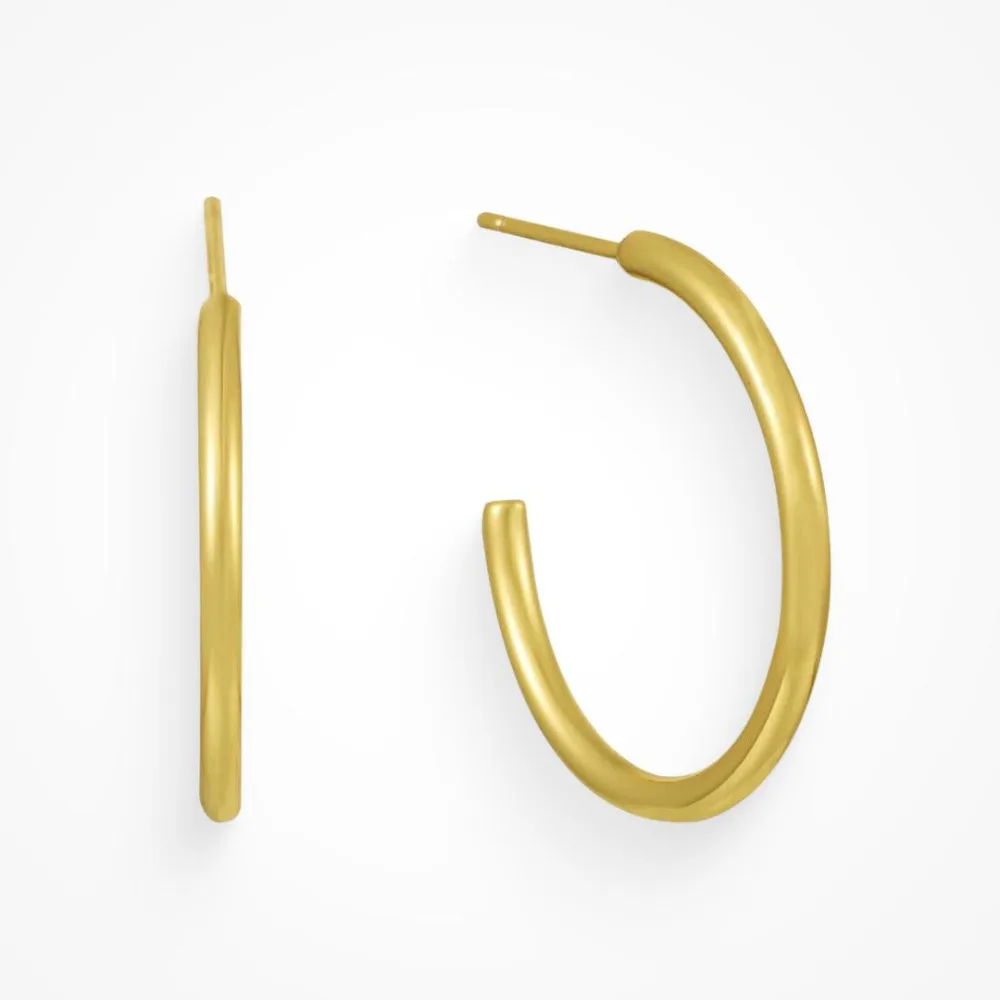Best Waterproof Gold Jewelry Under $20: What Tarnish-Free Really Means 4 A large thin gold open hoop earring shown from the front and the side, noticeably wider in diameter and slimmer in profile than a chunky hoop