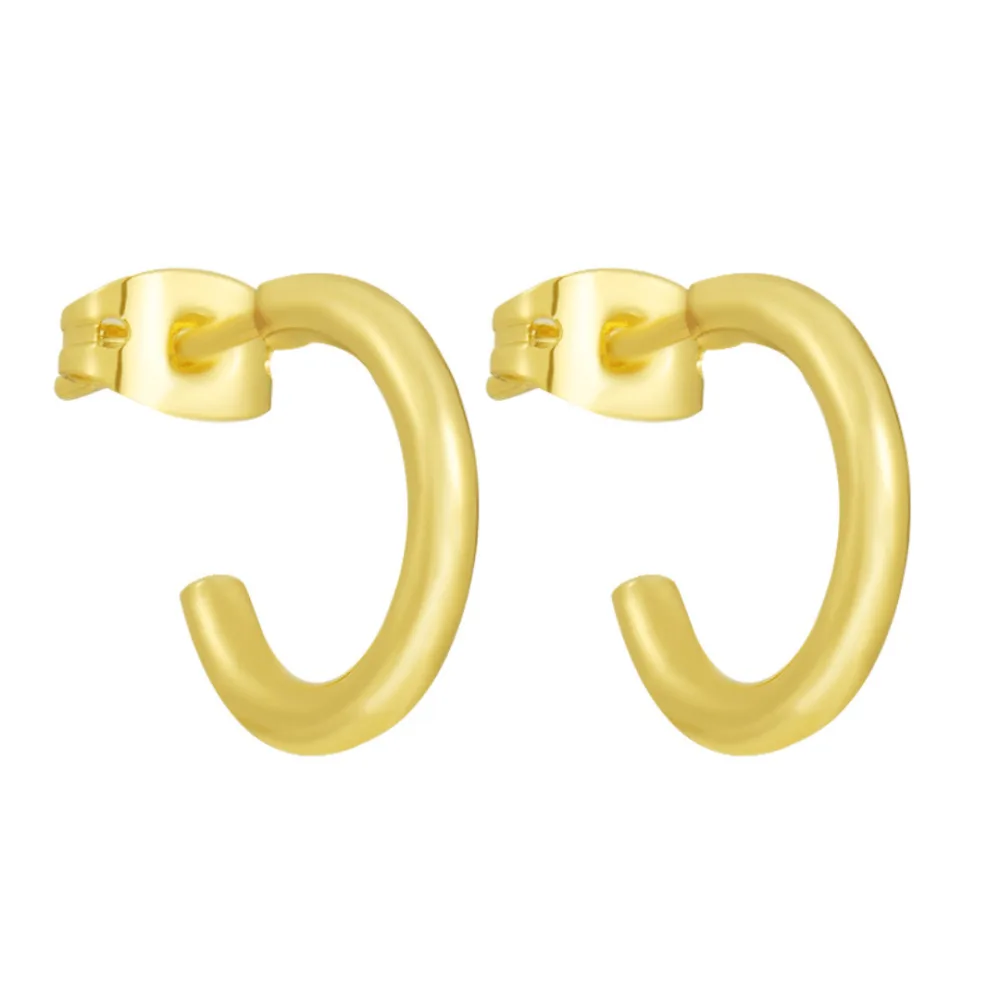 Best Waterproof Gold Jewelry Under $20: What Tarnish-Free Really Means 2 A pair of small gold open hoop earrings with butterfly backs, the hoop ends left unjoined
