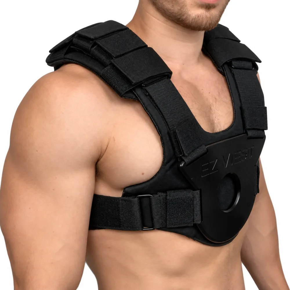 Close side view of the wider 4-inch shoulder padding fitted to the EZ-VEST, showing the layered velcro straps across the shoulder
