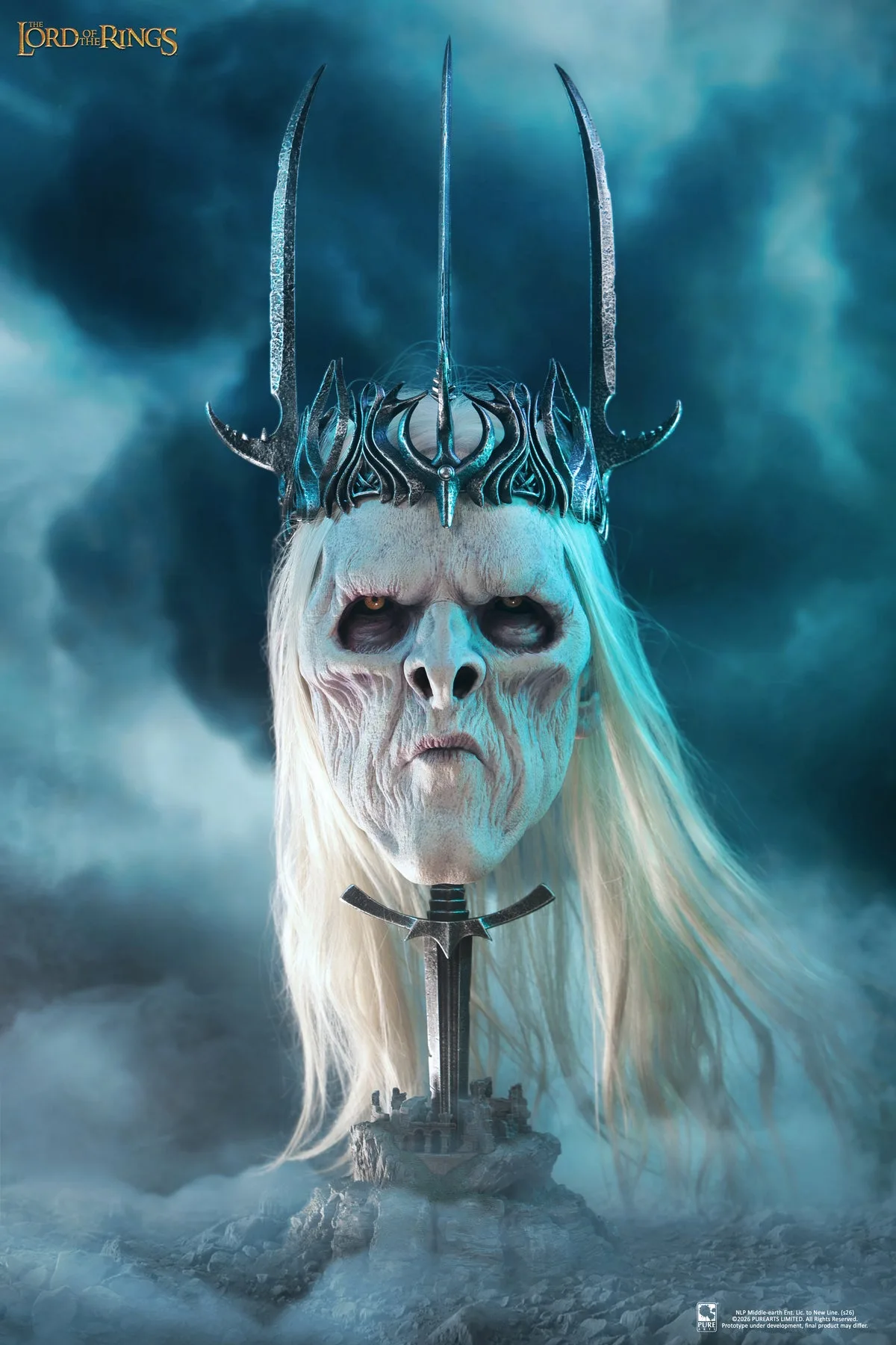 The Nazgul King life-size art mask, a pale gaunt face with sunken amber eyes and long white hair under a spiked iron crown, mounted on a sword hilt against blue mist