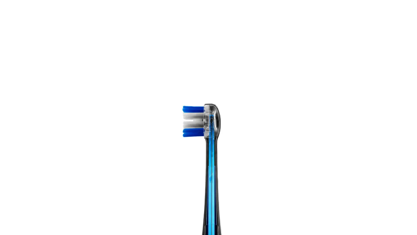 Close view of a Ranvoo AirJet brush head, a transparent neck with a small cluster of blue and white bristles at the tip