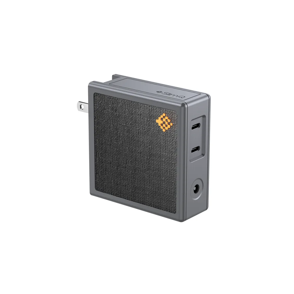The SlimQ 150W DC and USB-C GaN charger, a compact grey brick with a barrel DC output and two USB-C ports