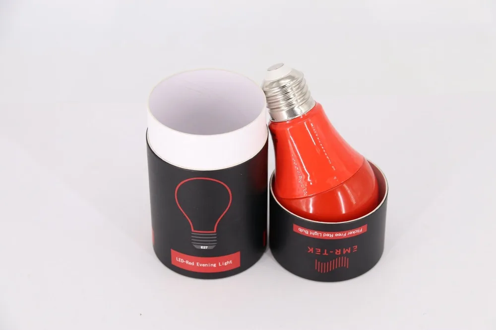 The EMR-TEK Sunset bulb, a red LED bulb resting in its black cylindrical package labeled LED Red Evening Light