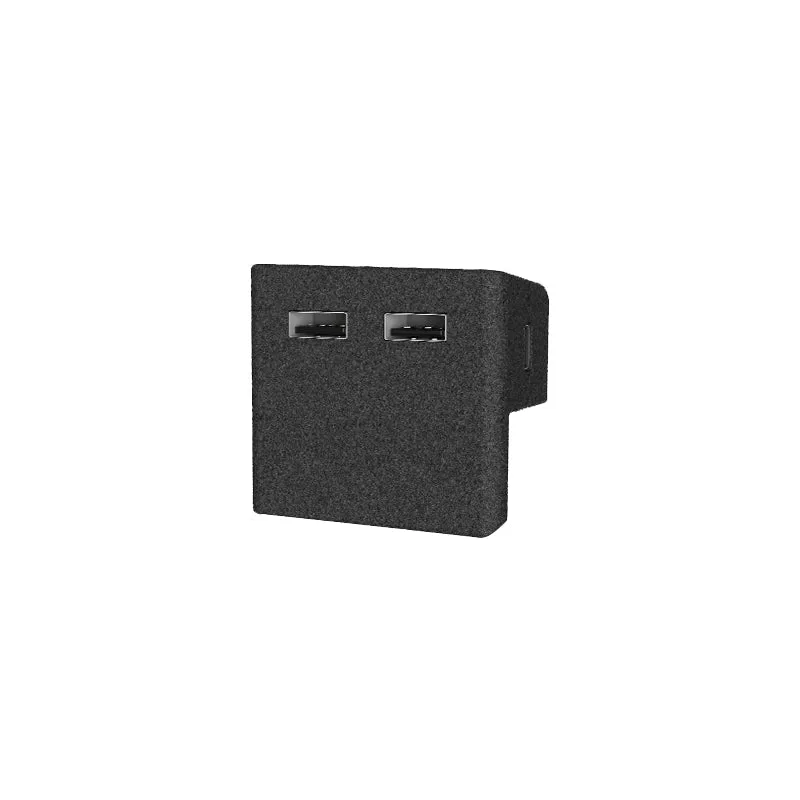 A small dark felt covered block with two USB-A ports on its face, designed to sit inside the glove box